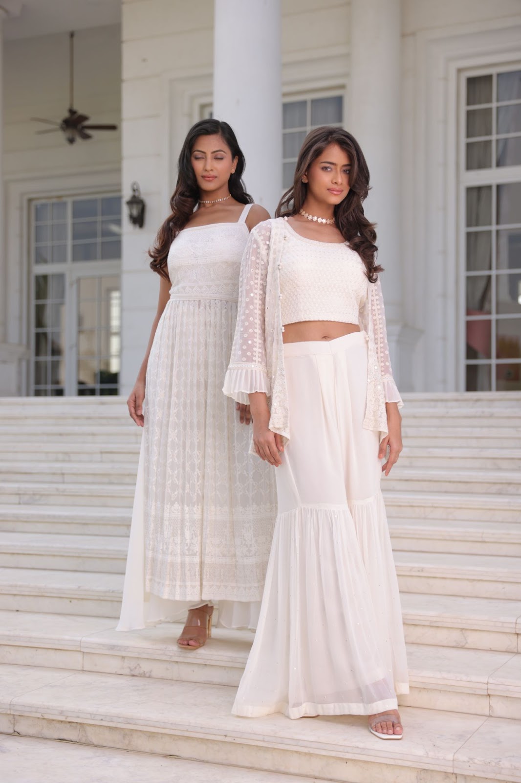 Two models wearing contemporary chikankari lehenga.